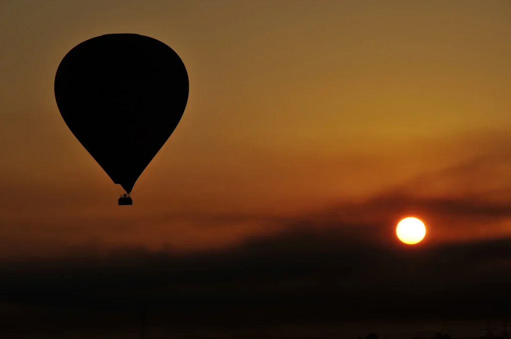 Hot air balloon over Luxor at sunrise