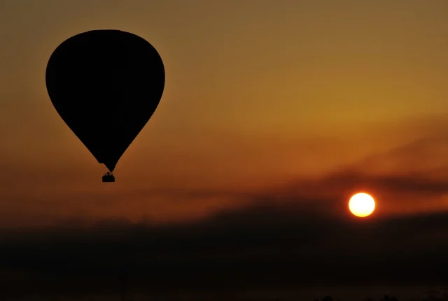Hot air balloon over Luxor at sunrise